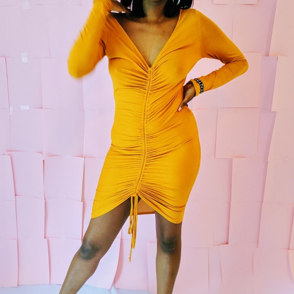 Yellow/gold bodycon dress